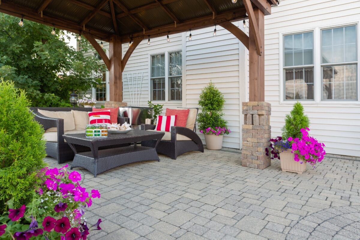 Backyard pool with screened porch, patio, and outdoor seating