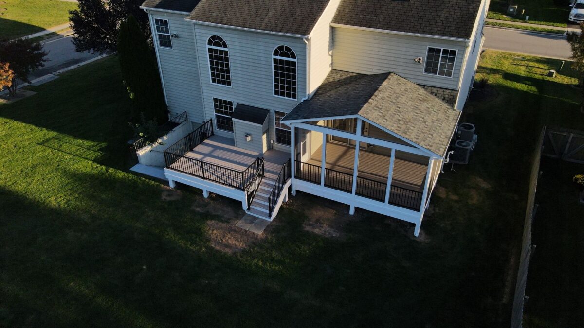 Aerial view of backyard deck and covered porch