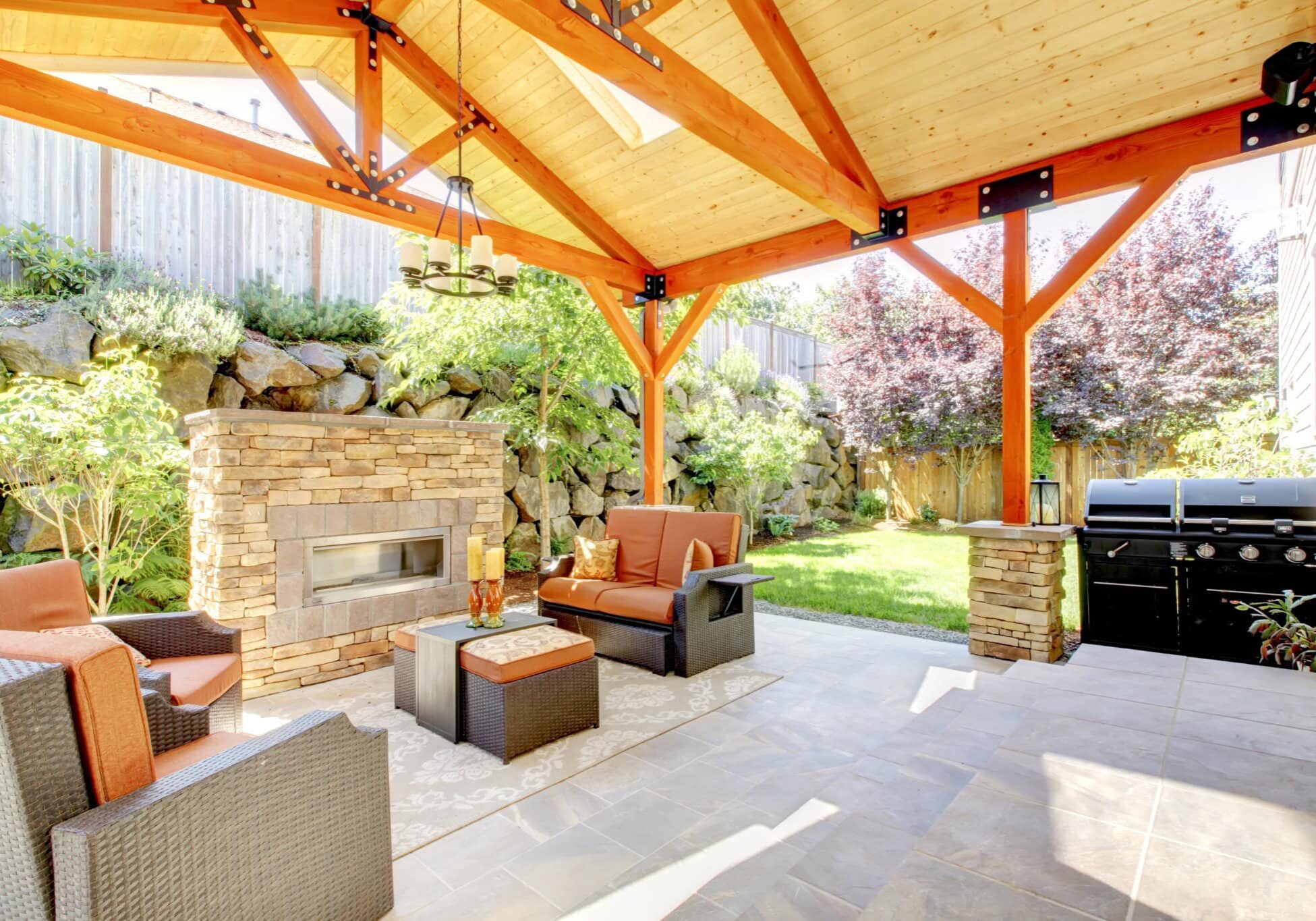 covered-patio-with-outdoor-fireplace-and-grill